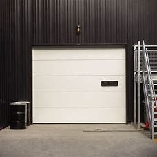 Porte sezionali isolate della divisione del garage per il pannello sopraelevato commerciale della porta della villa