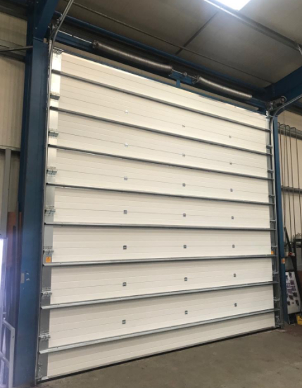 Esportatori di porte sezionali industriali per stazione dei pompieri con serratura di alta sicurezza, formate automaticamente e con serranda avvolgibile antincendio a rilascio di emergenza